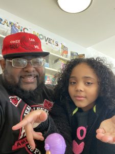 Father holding daughter